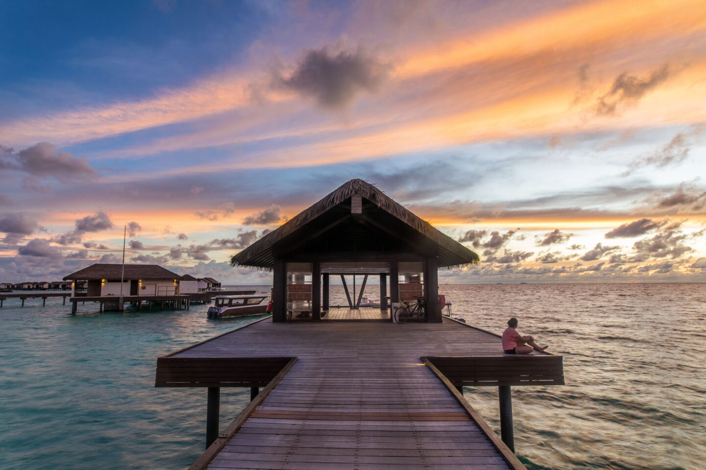 Serene waterfront setting during sunset, representing a 'What If Story' backdrop, captured during a travel to Maldives