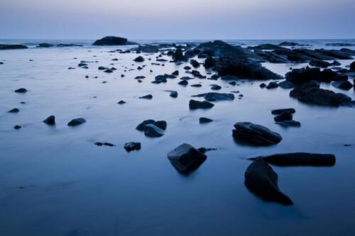 a long exposure of a rocky beach